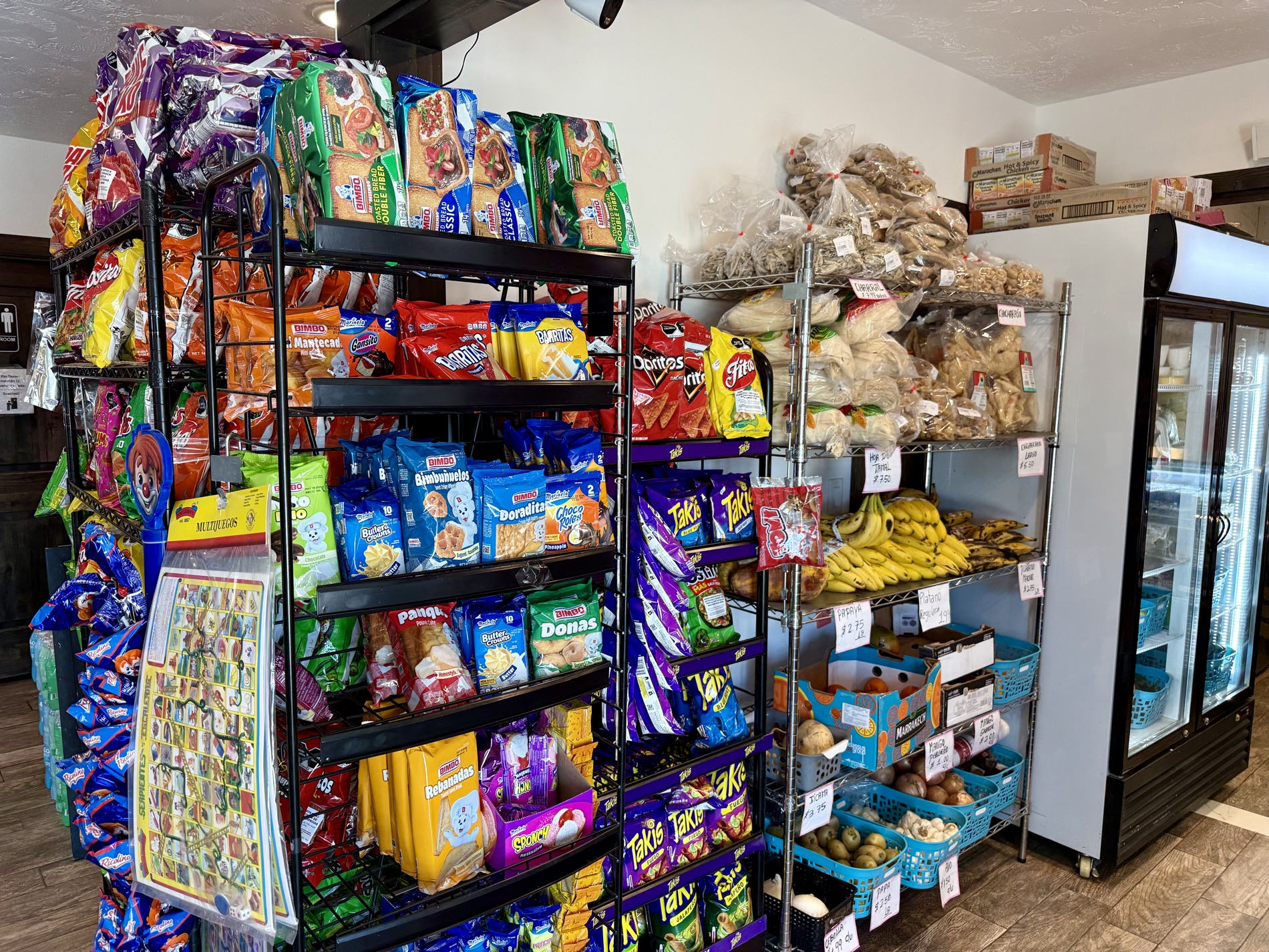Snack racks, hanging chicharrones, and fresh produce